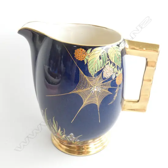 A Carlton ware enamelled spider's web jug
